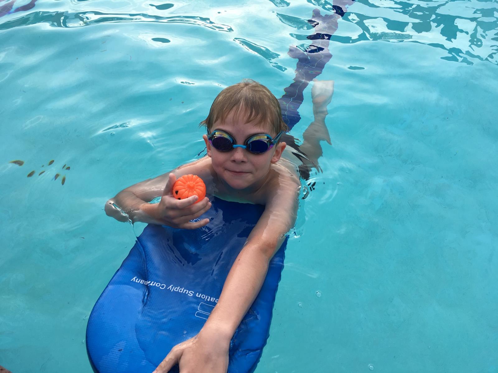 swimmer with kickboard