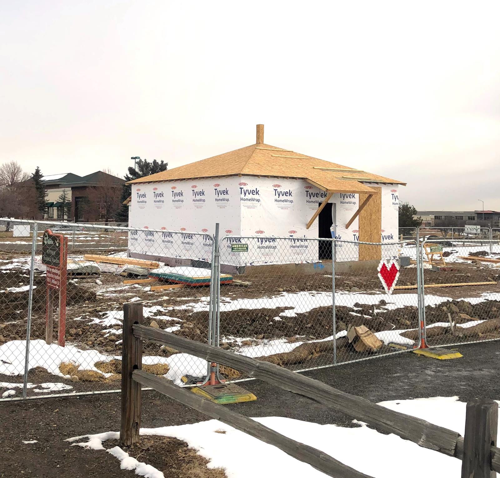 Insalation and a roof are added to the structure for the Historical Musuem Rebuilding Project.