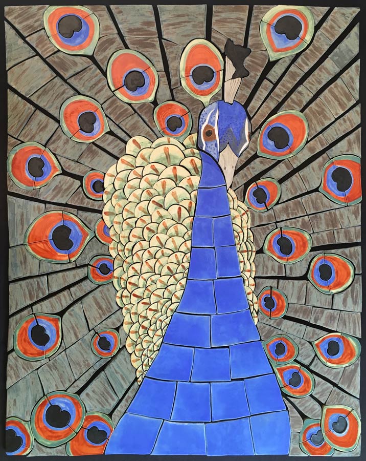 Ceramic chards in browns, blue, orange and yellow form a peacock in a mosaic style