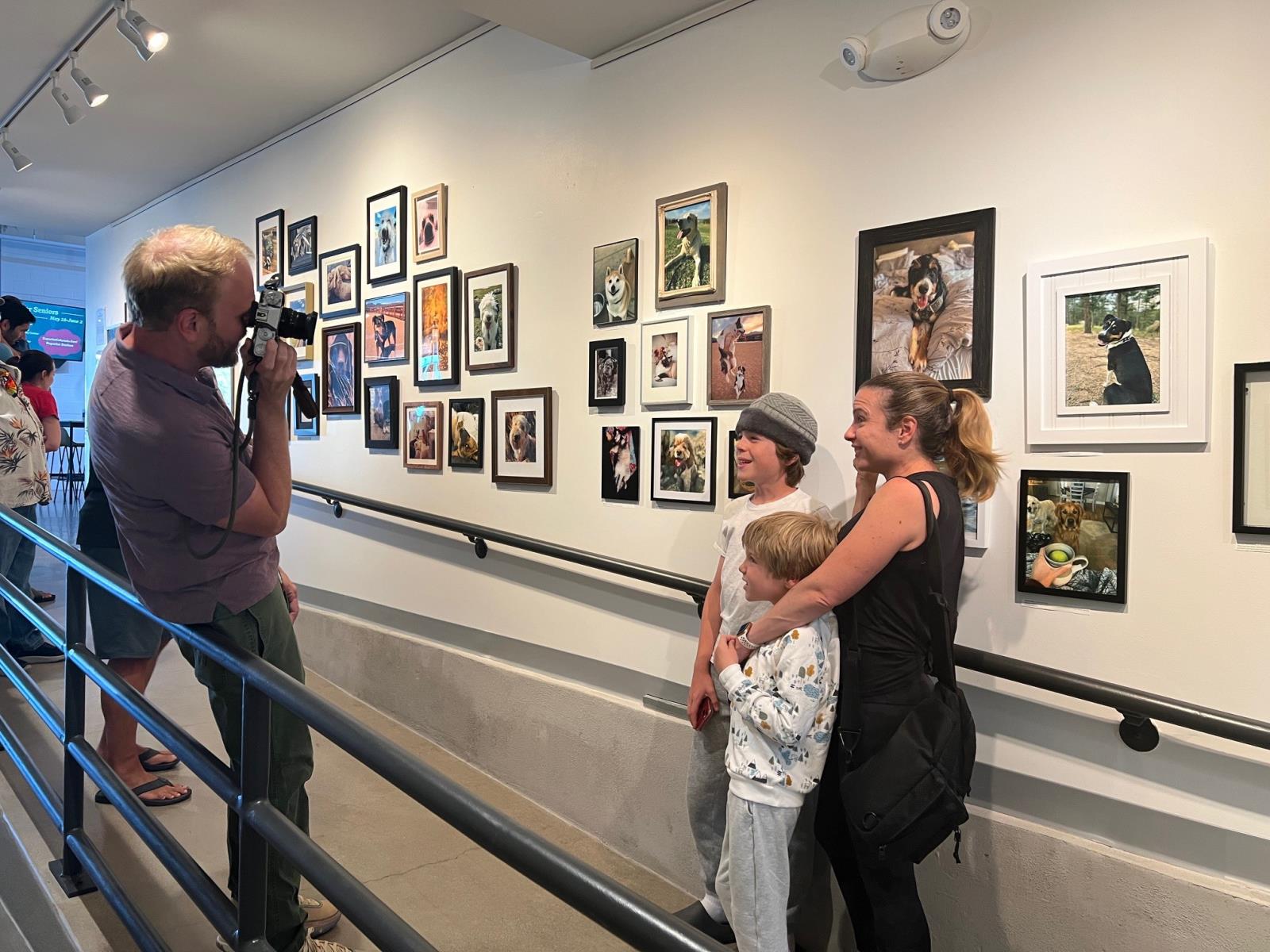 People enjoying the 2024 Pet SNAPs exhibit.