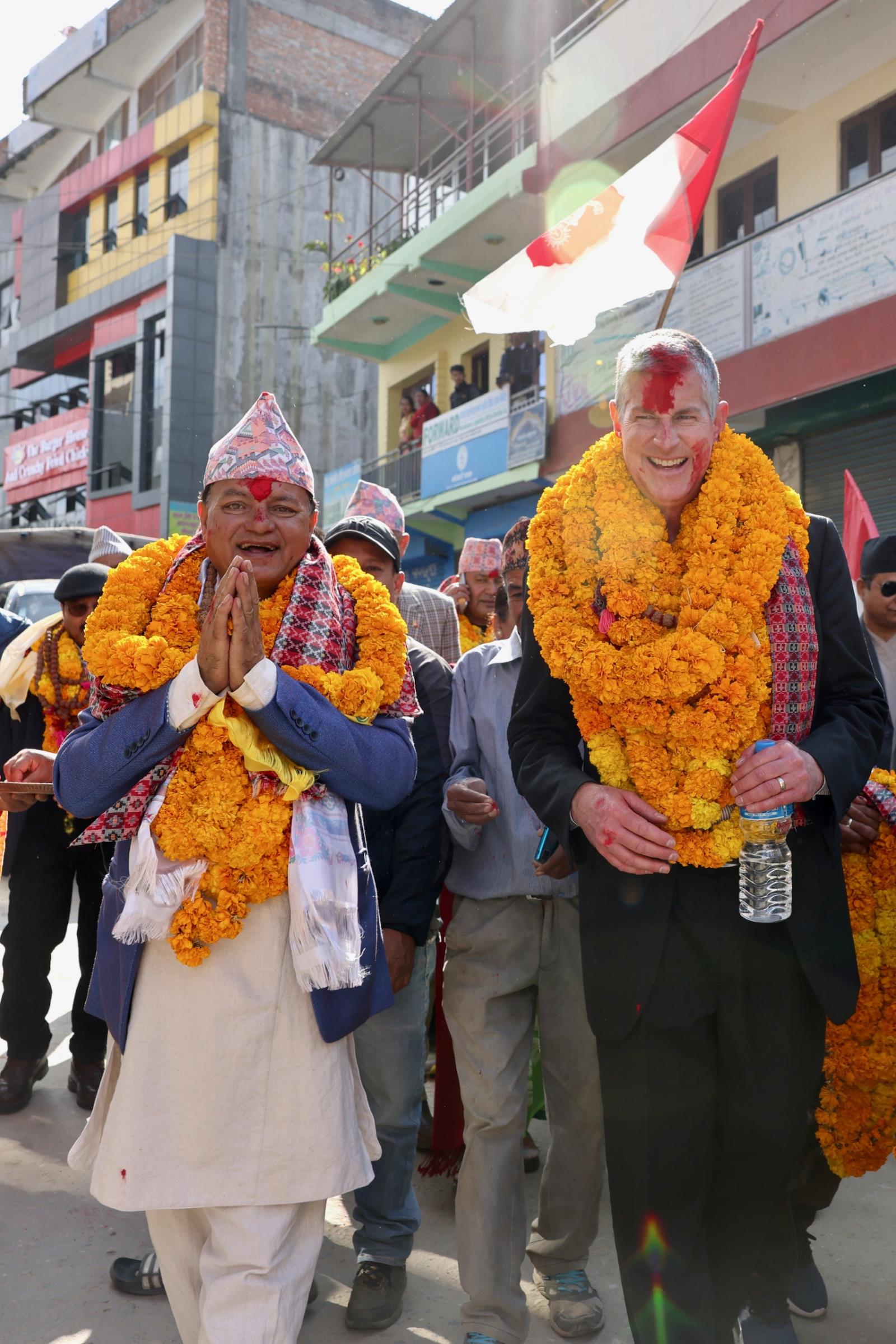 Mayor Fulsom walking down the streets of Khandbari with a big smile.